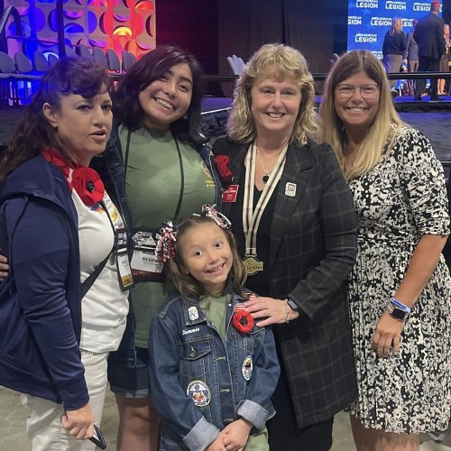 8-25-24 - 105th National Convention, New Orleans, LA - By Martha Romano: At the conclusion of the Memorial Service, Juniors Activities saw a photo opportunity for the Juniors. National President Lisa Williamson surprised us and pinned Rebeka & Sammie.