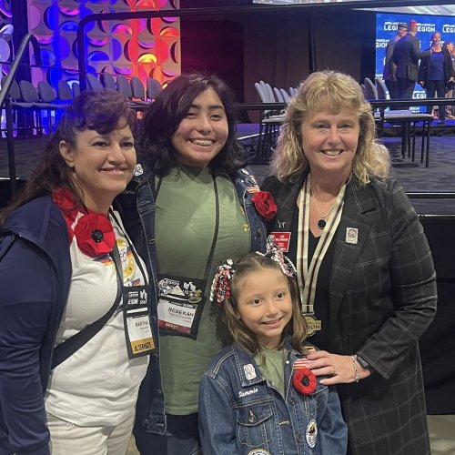 8-25-24 - 105th National Convention, New Orleans, LA - By Martha Romano: At the conclusion of the Memorial Service, Juniors Activities saw a photo opportunity for the Juniors. National President Lisa Williamson surprised us and pinned Rebeka & Sammie.